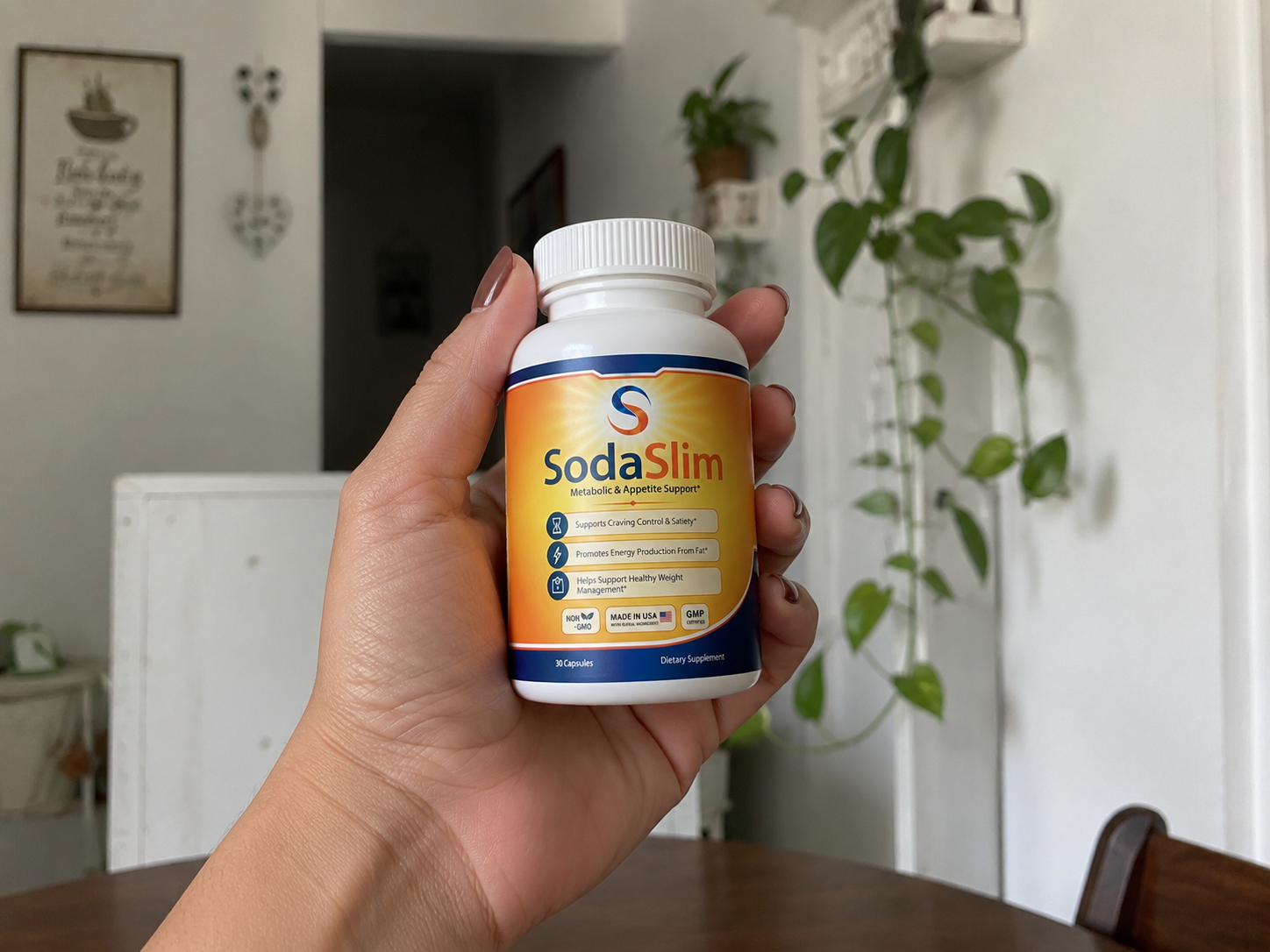 SodaSlim weight management capsules held in hand